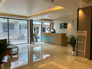 a lobby of a store with a reception desk at Hotel Orelio - Airport Hotel in Bangalore