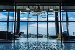 a room with a view of a building with windows at The Gate Hotel Osaka by Hulic in Osaka