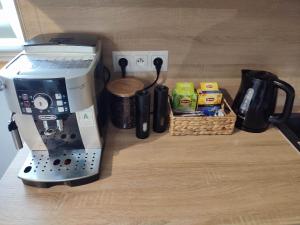 a coffee maker sitting on top of a counter at Chabrowy Domek in Jeżów Sudecki +9 photos