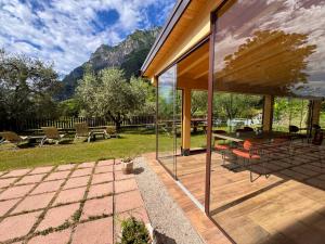 a house with a patio with a table and chairs at Agritur Girardelli in Riva del Garda +22 photos