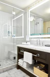 a bathroom with a sink and a shower at L'Auberge Del Mar Resort and Spa in San Diego