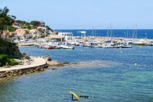 a view of a harbor with boats in the water at Cozy duplexterrace barbecue pool beach on foot in Le Pradet