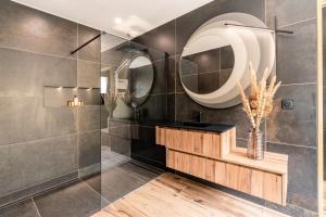 a bathroom with a sink and a mirror at Villa Signature Luxury & Exclusive seaside getaway in Le Grau-dʼAgde +71 photos