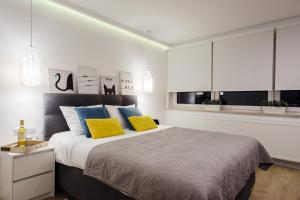 Postel nebo postele na pokoji v ubytování Apartamenty MISTRAL