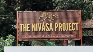 a sign for the nyssa project on a building at The Nivasa Project in Agonda