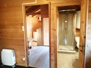 a room with a walk in shower and a glass door at Saut du moine in Simiane-la-Rotonde +19 photos