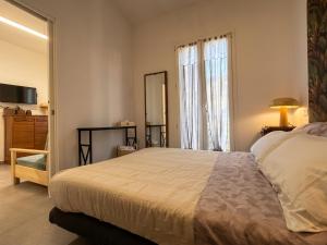 a bedroom with a large bed and a mirror at Camera con Vista in Cervia