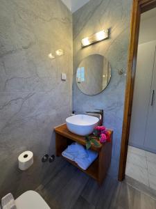 a bathroom with a sink and a mirror at Charoula in Platanias +52 photos