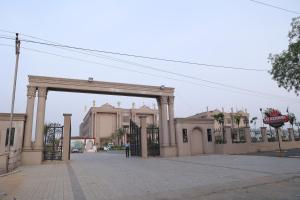 an entrance to a building with a large gate at Sai Krishna Hill View Resort in Pawārkhera