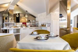 a kitchen with a table with two tea cups on it at Ca' Del Campo in Venice
