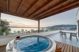 a hot tub on the deck of a house at Batıhan Beach Resort & Spa in Kuşadası