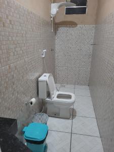 a bathroom with a toilet and a shower at Manancial de Aguas V in Barreirinhas