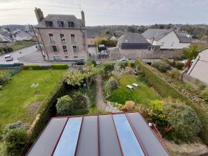 an aerial view of a house with a roof at lgbt friendly in Dinan