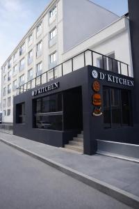 a building with a sign for a hotel at D'Premium in Edirne