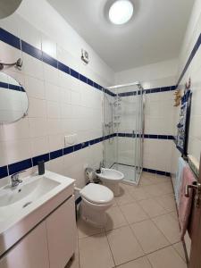 a bathroom with a toilet and a sink and a shower at Top Leme Bedje in Santa Maria +15 photos