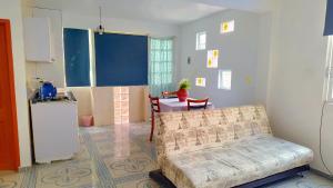 a kitchen with a couch and a table in a room at Estadio GNP and Airport AICM in Mexico City +12 photos