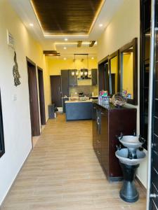 a large kitchen with a toilet in the middle of it at Hestia by Gunner Lodges in Patriata +31 photos