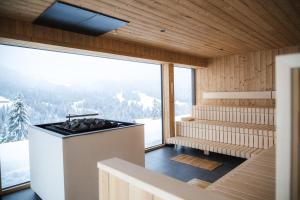 a sauna with a view of the mountains at Bio-Berghotel Ifenblick in Balderschwang