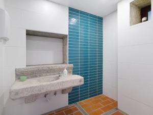 a bathroom with a sink and a mirror at Quinta do Avô - Casa de Campo in Terras de Bouro