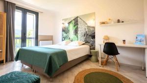 a bedroom with a bed with a green blanket at Casa nova in Sagone +31 photos