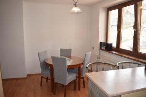 a dining room with a table and chairs at Domček pod Kalváriou in Ružomberok +21 photos