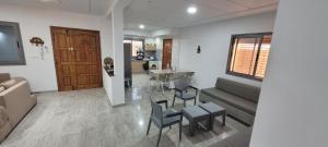 a living room with a couch and chairs and a table at Villa in Ouled Yaneg in Ouled Yaneg +1 photo