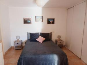 a bedroom with a large bed and two night stands at La croce in Letia