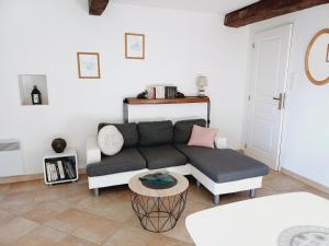 a living room with a couch and a table at La croce in Letia