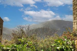 a view of the mountains from the top of a hill at La croce in Letia