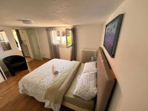 a bedroom with a bed with a stuffed animal on it at Appartement causy in Gonfreville-lʼOrcher
