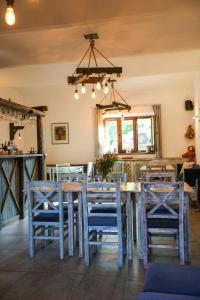 a dining room with a table and chairs at Statek Český Dvůr in Postupice