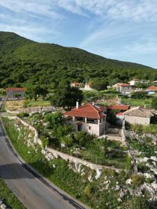 a small village on the side of a road at Mountain Escape Villa in Gamvriá +11 photos