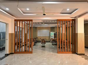 a conference room with chairs and tables in a building at Hotel Deep Khirsu in Malaī