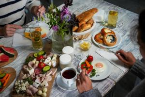 a table with a bunch of food and drinks at Statek Český Dvůr in Postupice +13 photos