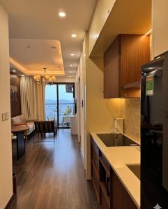 a kitchen with a view of a living room at Anmie Home - Hoàng Huy CMC in An Khê