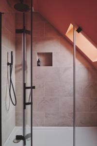 a bathroom with a shower in a attic at Haymill Retreat in Trefeglwys +37 photos
