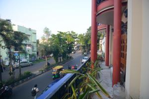a view of a city street from a building at Harshita's Guest House in kolkata