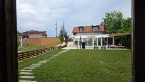 a view of a house from a window of a yard at Vino & Vista in Ripanj +48 photos