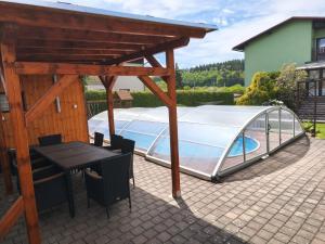 a swimming pool under a cover on a patio at U Pepana in Velké Svatoňovice