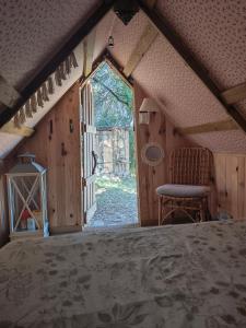 a view of a room with a bed and a window at Nuit insolite et féerique tout près d'Ajaccio in Alata