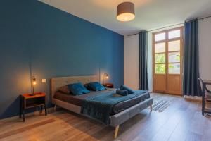 a bedroom with a bed with a teddy bear on it at T4 Cosy - Château - Wifi in Aubenas