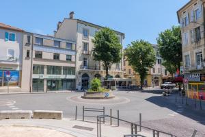 an empty street in a city with buildings at T4 Cosy - Château - Wifi in Aubenas