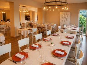 a dining room with white tables and white chairs at San Lorenzo Si Alberga in Camigliatello Silano