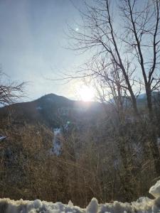 a view of a mountain with snow on the ground at Lekic B&B in Kovačica