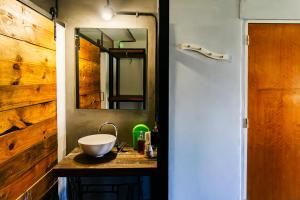 a bathroom with a sink and a mirror at Go Hostel in Córdoba +48 photos