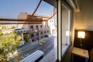 a view of a city street from a window at Go Hostel in Córdoba