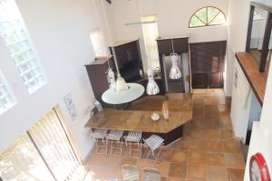 an overhead view of a kitchen with a sink and chairs at Selah Sands in Port Alfred +23 photos