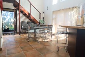 a dining room with a table and chairs at Selah Sands in Port Alfred