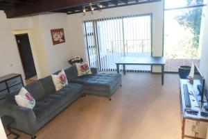 a living room with a couch and a table at Selah Sands in Port Alfred