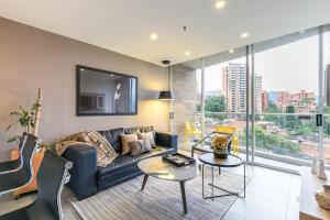 a living room with a couch and a table at Soul Lifestyle Hotel in Medellín